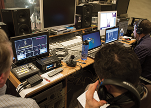 Technicians at work in Bellefield Hall’s William R. Robinson Recording Studio.