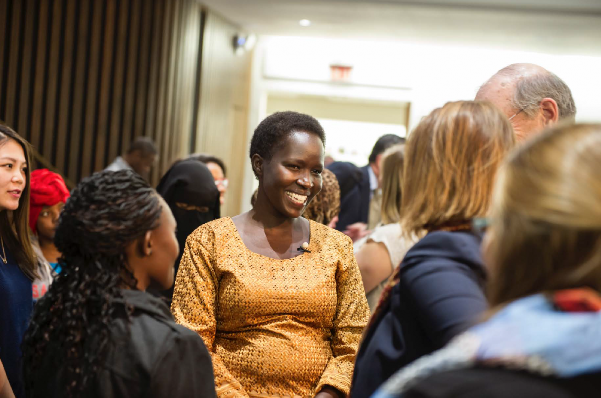 Kakenya smiling in a crowd