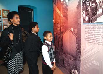 Terri, Jared, and Kipauno Washington explore the exhibition