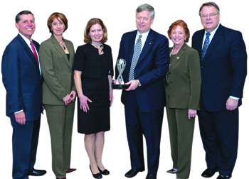 The American Association of Retired Persons (AARP) selected the University of Pittsburgh as one of the nation’s 50 “Best Employers for Workers Over 50.” Top officials from AARP Pennsylvania presented Pitt’s award to Chancellor Mark A. Nordenberg on March 15. From left are Ron Frisch, Pitt associate vice chancellor for human resources; Amy Korb, Department of Human Resources administrator; Kelly Altmire, AARP Pennsylvania associate state director; Nordenberg; Estella Hyde, AARP Pennsylvania state president; and Richard Chevrefils, AARP Pennsylvania state director.  