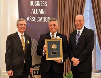 The Joseph M. Katz Graduate School of Business and College of Business Administration held its 47th Annual Business Alumni Awards Program on April 15 in Pitt’s University Club. Pitt Board of Trustees Chair Stephen Tritch (MBA ’77), retired chair of Westinghouse Electric Co., received the H.J. Zoffer Medal for Meritorious Service. Standing, from left, are Katz Dean John Delaney, Tritch, and Pitt Business Alumni Association President Jeff Marzina  (MBA ’87).