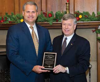 The Central Blood Bank (CBB) of Pittsburgh presented the University of Pittsburgh with a plaque to honor Pitt’s second-place ranking in the CBB’s 2010 Top Donor Groups recognition. The University collected 2,738 units of blood during the fiscal year that ended June 30, 2010. James Covert  (left)(A&S ’91), president and CEO of the CBB’s parent company, The Institute for Transfusion Medicine, met at Pitt with Chancellor Mark A. Nordenberg and other University representatives on Dec. 21. 