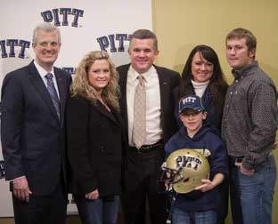 From left, Pitt Athletics Director Steve Pederson, Haylee Graham, Todd Graham and his wife, Penni, Hank Graham, and Michael Todd Jr. (wearing Pitt hat)