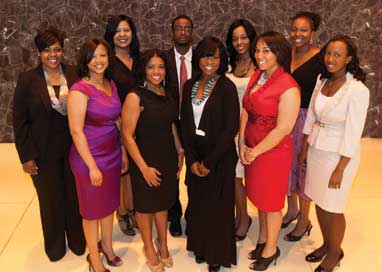 The New Pittsburgh Courier’s annual FAB 40 reception—which recognizes 40 African Americans under age 40 for contributions to their professions and their communities—was held April 29 in the U.S. Steel Tower, Downtown. Among the honorees were a number of Pitt alumni and faculty. Front row, from left: Allyce Pinchback (A&S ’09), education program manager for the World Affairs Council of Pittsburgh; Kezia Taylor (LAW ’06), an attorney with Pepper Hamilton; Melissa Wade (A&S ’96), creative services producer for KDKA-TV;  Marisa Bartley (A&S ’05), branch manager with Citizens Financial Group; and Bethany Miller (LAW ’08), a lawyer with Tucker Arensberg. Back row, from left: Jessica Brooke Ruffin (A&S ’06), community impact director for Amachi Pittsburgh; Nicole Manns, vice president and manager of affirmative action compliance for BNY Mellon; Oronde Sharif (SOC WK ’97G, A&S ’95), Pitt lecturer and an advisor in Pitt’s Department of Africana Studies; Latika Davis-Jones (SOC WK ’07G, GSPH ’07), an administrator with Allegheny County’s Department of Human Services and an adjunct professor in Pitt’s School of Social Work; and Yolanda Covington-Ward, Pitt assistant professor of Africana Studies. 