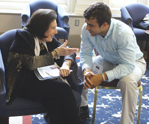 Frances Hesselbein confers with Pitt senior Andrew Taglianetti.