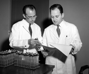 Jonas Salk (left) with Julius Youngner.