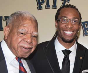 Johnson-Fitzg Justin M. Johnson, retired Superior Court of Pennsylvania judge, and Larry Fitzgerald (A&S ’06), Pitt football player from 2002 to ’04, wide receiver for Arizona Cardinals.