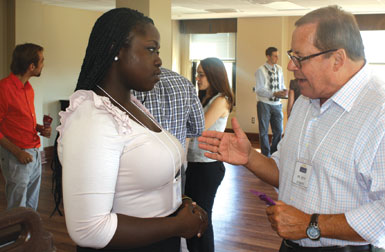 Also serving as a professional mentor was Pitt trustee and former Pitt Alumni Association president Keith Schaefer (A&S ’71), right, president and CEO of BPL Global, Ltd. He is speaking with Lesley “Yemi” Adewunmi (A&S ’10), a summit attendee and former president of Pitt’s Black Action Society.