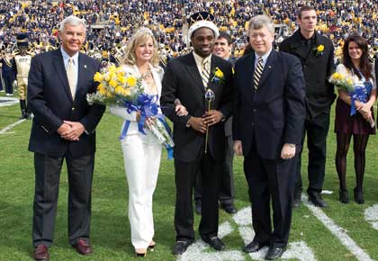 From left, Jack Smith, president of the Pitt Alumni Association; Homecoming Queen Lauren Zammerilla, a senior neuroscience major; Homecoming King Jamil Alhassan, a junior biology major; and Pitt Chancellor Mark A. Nordenberg. 