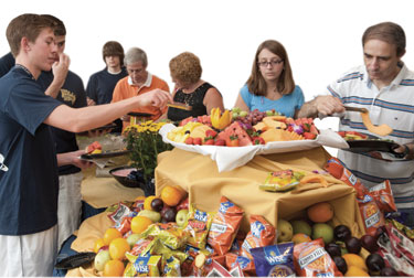 Students and their families feasted their way through a buffet line during the Aug. 25 Chancellor's Welcome Picnic at the Petersen Events Center.