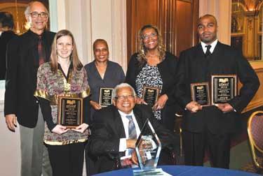 Enjoying the May 19 reception for the Pittsburgh Black Media Federation’s (PBMF) annual Robert L. Vann Awards were a number of Pitt awardees and members of the University community. Seated is George E. Barbour (A&S ’51), a former award-winning reporter for the Pittsburgh Courier. Standing, from left, are Pitt history professor Laurence Glasco; Pitt Magazine Senior Editor Cara Masset; Deborah Walker, student conduct officer and assistant to the dean in Pitt's Office of Student Affairs, who was the focus of a Vann Award-winning story in the University Times by reporter Peter Hart; freelance writer Renee Aldrich; and Anthony M. Moore, assistant to Pitt Vice Chancellor for Public Affairs Robert Hill.