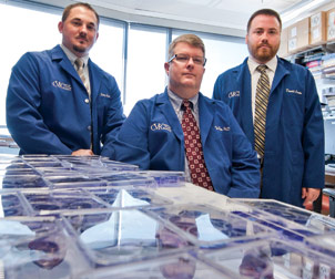 Ted Ross’ (center) lab is part of Pitt’s Center for Vaccine Research (CVR), where scientists study a wide range of bacterial and viral pathogens, focusing primarily on emerging infections and biodefense. Ross, a professor of microbiology and molecular genetics in Pitt’s School of Medicine, is an expert in pathogen-host interactions. His research focuses on the development of effective vaccine design for infectious agents such as influenza and HIV. His research team includes research specialists Corey Crevar (left) and Donald Carter (right).