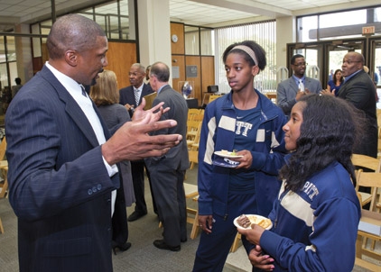 Woodruff-Display#3 Roger Kingdom (CGS ’02), winner of two Olympic gold medals (1984 and 1988) in the 100 meter hurdles, talks with Ashley Corum, Big East champ in the triple jump (left), and Ashley Woodford, who holds Pitt’s school record in the 4x100 event.
