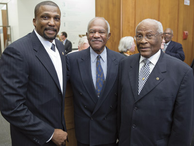 Woodruff-Display#4 From left, Kingdom, Arnold M. Sowell Sr. (BUS ’57), who set an indoor world record for the 880-yard run in 1957, outrunning gold medalist Tom Courtney; and Douglas.