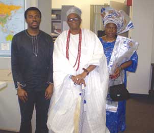 YorubaKing-w-Wife&Son Pitt’s African Heritage Nationality Room received a visit from a West African tribe’s royal family, who examined one of the room’s treasures, a former Yoruba king’s exquisitely beaded tunic. Oba Olusanya Adegboyega Dosunmu (center), the 13th Oluwu of Nigeria’s Owu Kingdom; his son (left), Pitt ethnomusicology PhD alumnus Oyebade Dosunmu (A&S ‘10G, ‘05G); and the Oluwu’s wife, Olatubosun Abiodun Dosunmu, (right) visited the Nationality Rooms Programs’ office on May 17. The ethnic people of Owu are part of West Africa’s Yoruba kingdom, which extends beyond the boundaries of Nigeria.