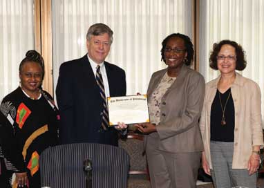 Chancellor Mark A. Nordenberg awarded his 2011 Affirmative Action Award to Alaine M. Allen, director of the Pitt Engineering Career Access Program (PECAP) in the Swanson School of Engineering. The award is presented annually to an outstanding University program area or individual that has made a significant contribution in affirmation action. The chancellor presented the $2,500 award to Allen during the June 15 University Senate Council meeting. In his June 10 letter to Allen informing her of the award, Nordenberg said the selection committee “lauded you as an ideal administrator whose experience with the range of services provided by the School of Engineering and the University brings the continuity of commitment and vision necessary to maintain both the reach and the depth of PECAP's affirmative action mission.” Nordenberg also noted that he was “particularly impressed” that Allen’s nomination was supported by two former PECAP participants. From left, Carol Mohammed, director of Pitt’s Office of Affirmative Action, Diversity, and Inclusion, who served as chair of the award selection committee; Chancellor Nordenberg; Allen; and Patricia Weiss, vice president of the University Senate and reference and information technology librarian for Pitt’s Health Sciences Library System. 