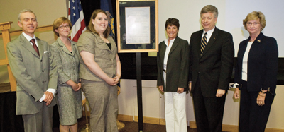 During its June 26 annual meeting, the Pitt Board of Trustees announced the creation of the Chief Justice Ralph J. Cappy Endowed Scholarship Fund in the Pitt School of Law. Sabrina Robinson, an entering first-year law student, will be the inaugural recipient of the Cappy Scholarship. From left, Board Vice Chair Robert M. Hernandez, Pitt Law School Dean Mary A. Crossley, Robinson, Janet Fry Cappy, Chancellor Mark A. Nordenberg, and Board Vice Chair Suzanne W. Broadhurst.