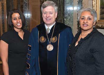 The chancellor stands with Meloney L. Fife (left) and Valerie Johnson Fife (right), the daughter and wife, respectively, of the late Jesse W. Fife Jr. (A&S ’72), who was also named a Pitt Distinguished Alumni Fellow for 2011. Fife, who knew of the honor before his passing on Dec. 6, 2010, was the executive vice president and chief operating officer of the Manchester Bidwell Corporation until his death.