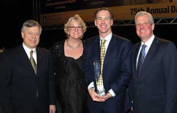 From left: Chancellor Mark A. Nordenberg,  Women’s basketball Head Coach Agnus Berenato, Men’s basketball Head Coach Jamie Dixon, and Athletics Director Steve Pederson at ceremony celebrating Coach Dixon as the Dapper Dan Sportsman of the Year.