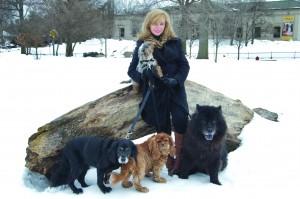 Graham Park pauses while walking her rescue dogs in Frick Park, Point Breeze.
