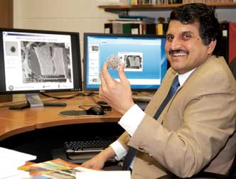 Prashant Kumta is developing advanced technologies to help overcome severe bone defects and injuries. Kumta is the Edward R. Weidlein Chair in the Swanson School of Enginnering and a professor in the Departments of Bioengineering, Chemical and Petroleum Engineering, and Mechanical Engineering and Materials Science. Using his expertise in bioceramics and biometallurgy, he is developing implantable materials (held in his hand) and delivery systems for ceramics, natural and synthetic polymers, and metals and novel nanoparticles. The goal? To be able to repair  “critical bone defects,” such as a missing segment of bone too substantial for the body to heal on its own. Inset: a bioresorbable ceramic cement scaffold.