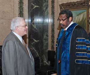 Pitt School of Education Dean Alan Lesgold (left) talks with William E. Strickland Jr. (A&S ’70), Pitt trustee, and president and chief executive officer of Manchester Bidwell Corporation.