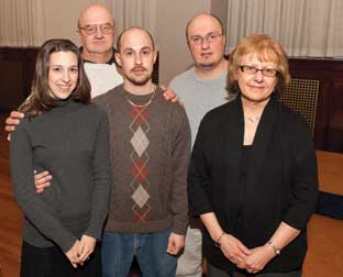 Members of Mike and Jo Rosol’s family garnered special recognition because of their allegiance to the University both as students and employees—six Pitt degrees among the five of them and a combined total of more than 100 years of service. Among the 19 employees with at least 40 years of service each, the Rosols met in 1970 while they were both employed at Pitt. Today, Mike Rosol (CGS ’75) is manager of Pitt’s bulk mail services in Point Breeze. Jo Rosol (CGS ’88, EDUC ’93) is director of enrollment management in the College of General Studies. Their son Jason (CBA ’01) is a grants administrator in the School of Medicine, and son Derek (A&S ’04) is a sales floor coordinator for the University Book Center. Derek’s fiancée, Julie DePascale (CGS ’05), is a secretary in the School of Arts and Sciences’ Department of Communication. Mike and Jo Rosol, like other employees with 40 years of service, were given watches. Front row (from left): Julie DePascale and Derek and Jo Rosol. Back row (from left): Mike and Jason Rosol. 