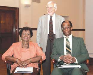      Two new members were welcomed into the “Fifty Year Club,” (sitting) Ethel Ellis, a research diet technician in the Clinical and Translational Science Institute, and Sherman Watson, an employee in the School of Dental Medicine’s Department of Instrument Management Systems. Both Ellis and Watson received chairs from Pitt to mark their service. Standing is Jerry Rosenberg, Pitt’s research integrity officer, who was recognized for 57 years of service. 