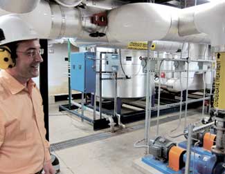 Above: Carrillo Street Steam Plant manager Marian Gagu stands before rows of industrial purifiers that monitor and control the pH balance of water heading into the boilers. 