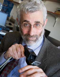 Pitt professor of bioengineering George Stetten holds The Sonic Flashlight™, a handheld ultrasound probe with a mirror and miniature display attached to it. Developed by Stetten, the device allows images to be viewed directly by medical practitioners without their having to turn their heads to view a screen, as is required in traditional ultrasound imaging. 