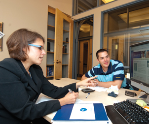 Ann Rairigh, (left) director of the Office of Veterans Services, and Pete Lahoda, a Pitt junior and Operation Iraqi Freedom veteran who is a work-study student in the new office.
