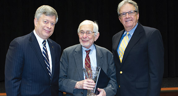 DISTINGUISHED SERVICE AND A TIP FOR LONGEVITY Jerome L. Rosenberg, Pitt’s research integrity officer in the Office of the General Counsel, was honored on Dec. 5 for 60 years of service to the University. Rosenberg, who joined Pitt in 1953 as an assistant professor of chemistry, was one 13 Pitt employees with 40 to 60 years of service who were honored by Pitt Chancellor Mark A. Nordenberg in the William Pitt Union’s newly renovated Assembly Room. Rosenberg stands between the Chancellor (left) and P. Jerome Richey, Pitt’s general counsel. Asked after the event whether he had a secret for such length of service and life, Rosenberg gave a nod to his wife. “As for tips, I am proud of an even longer role, as husband to Shoshana Rosenberg. We are now in our 68th year as a married couple. This may be a key to my survival.”